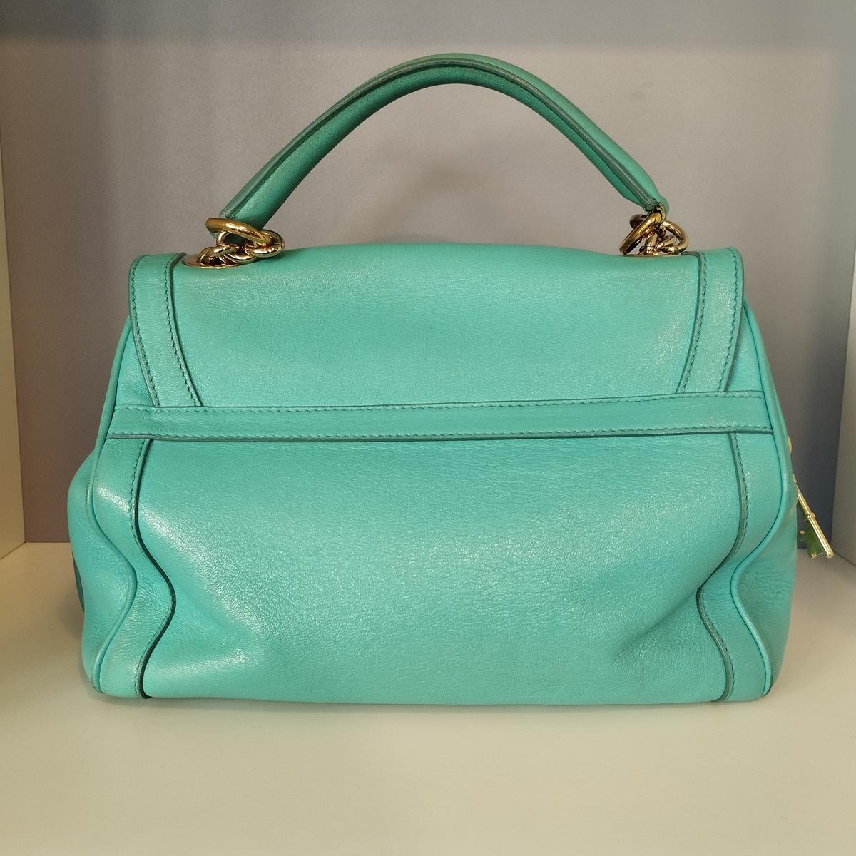 Leather
Azure color
Single handle
Can be carried crossbody (removable)
Golden metal parts
Lockit like closure
Animalier internal
Double internal pocket (one large zipped)
Cm 28,5 x 22 x 12,5 (11,22 x 8,66 x 4,92 inches)
Usure and signs as in