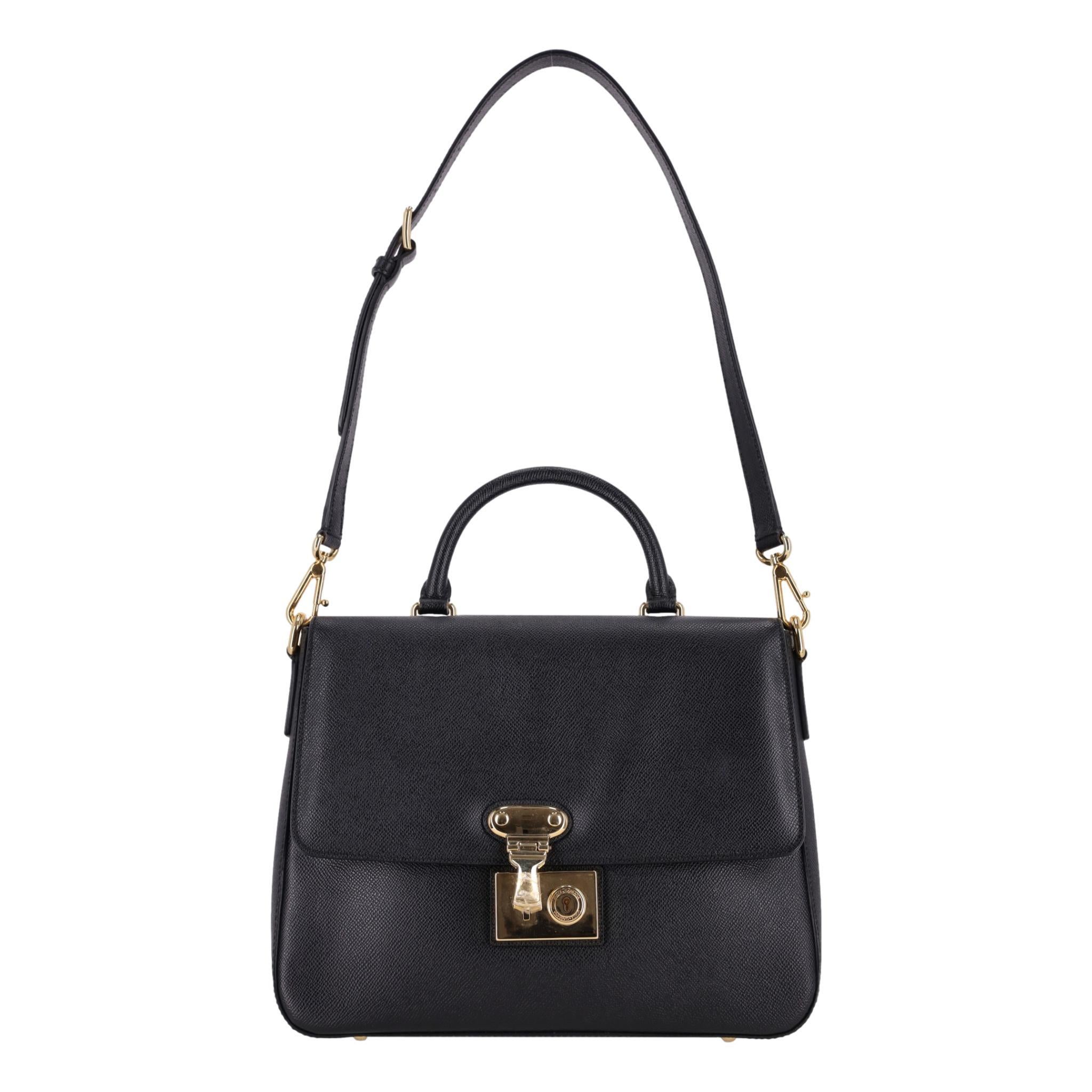 Dolce & Gabbana Miss Linda Saffiano Leather Bag

Black shoulder bag crafted from Saffiano leather with front flap and gold, branded push-lock closure buckle to the front.

Featuring top handle and detachable, adjustable leather shoulder strap.

The