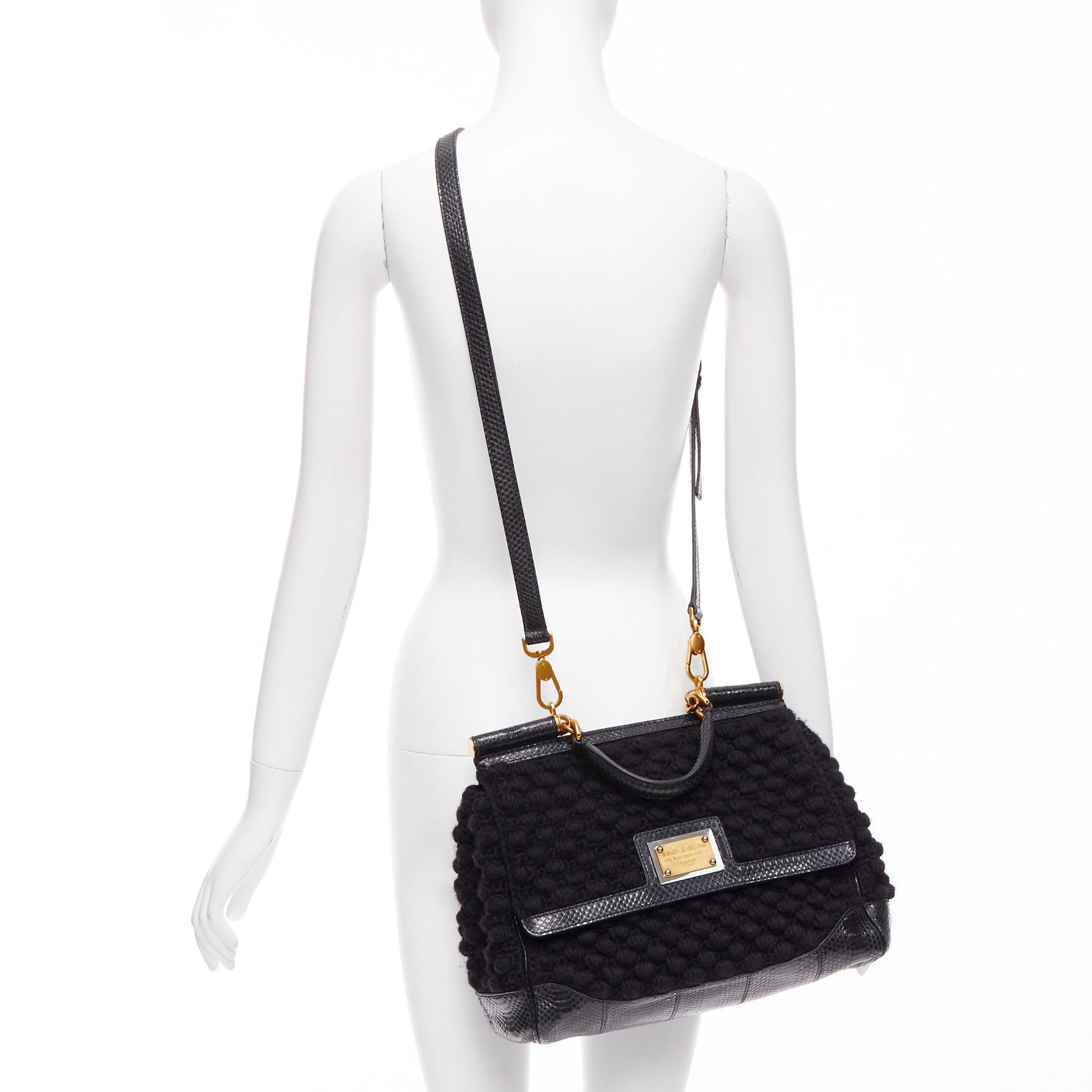 DOLCE GABBANA Miss Sicily black crochet scaled leather trim top handle bag
Reference: TGAS/D01139
Brand: Dolce Gabbana
Designer: Domenico Dolce and Stefano Gabbana
Model: Miss Sicily
Material: Wool, Leather
Color: Black, Gold
Pattern: Animal