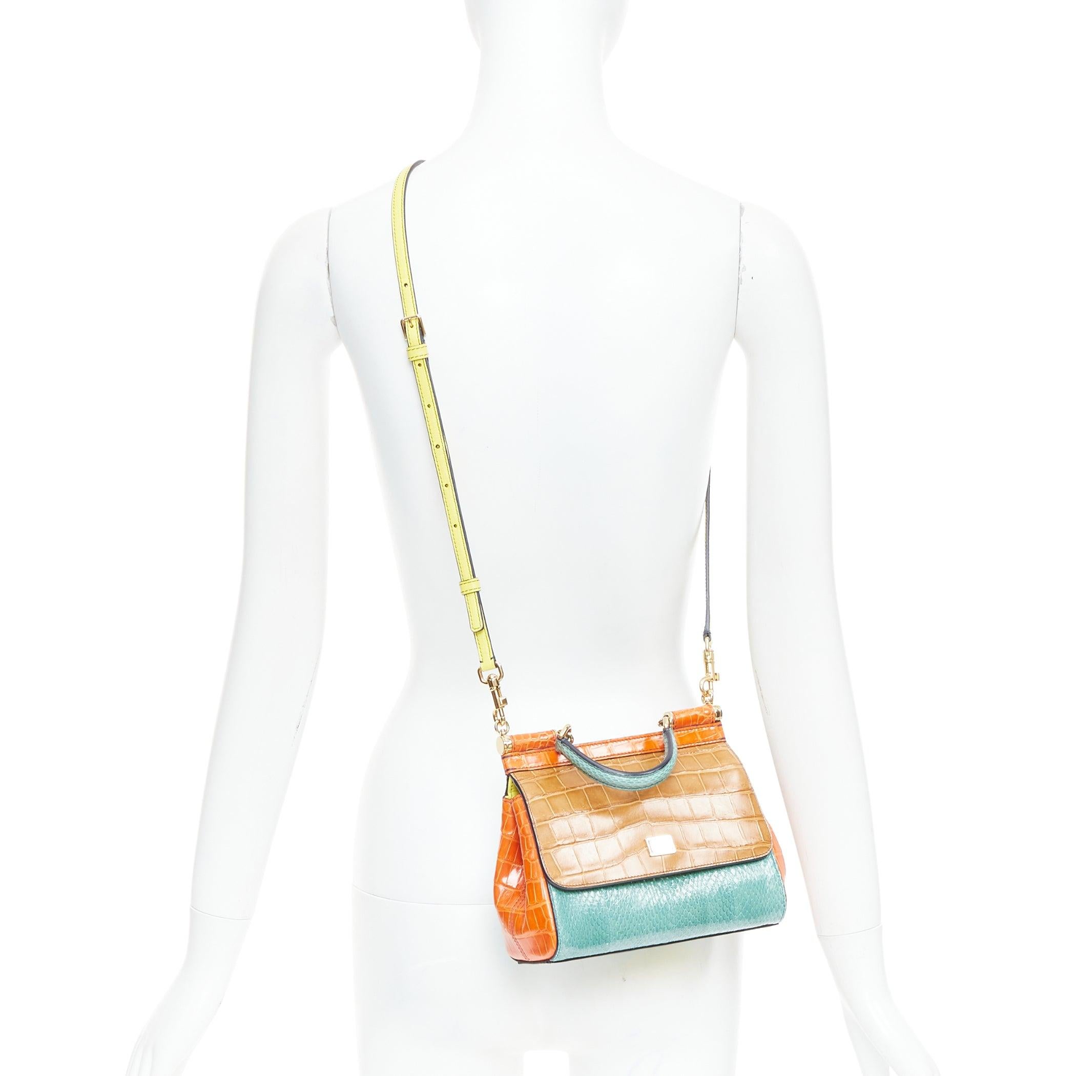 DOLCE GABBANA Miss Sicily colorblock scaled leather satchel crossbody bag
Reference: TGAS/E00684
Brand: Dolce Gabbana
Designer: Domenico Dolce and Stefano Gabbana
Model: Miss Sicily
Material: Leather
Color: Orange, Brown
Pattern: Animal