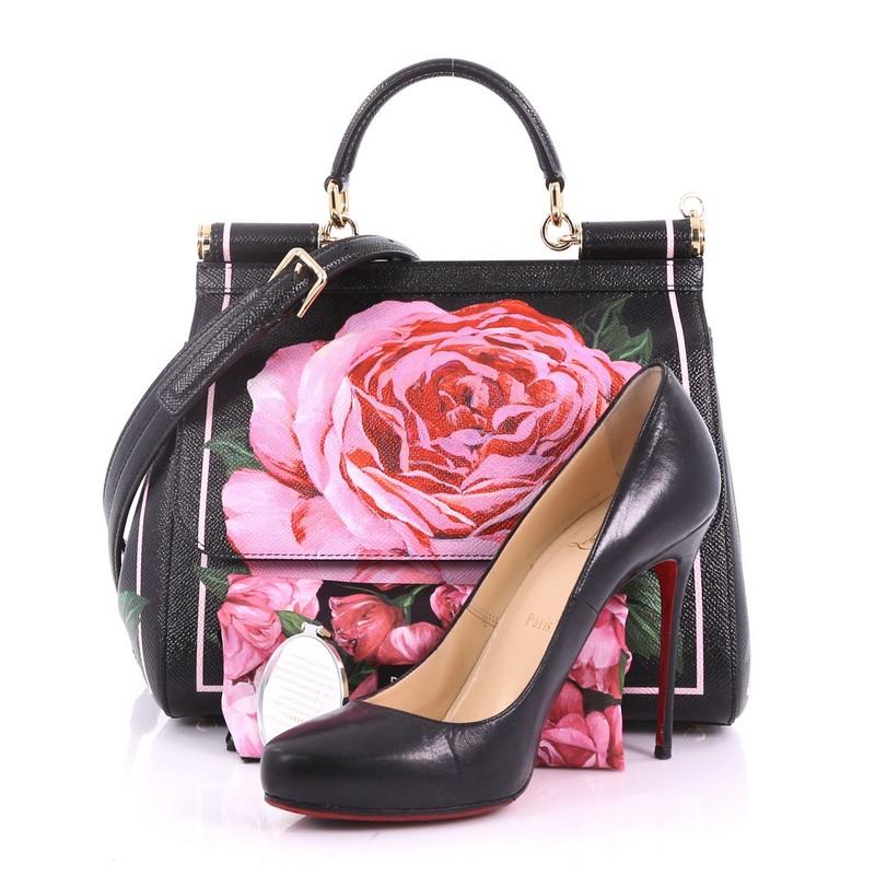 This Dolce & Gabbana Miss Sicily Handbag Printed Leather Medium, crafted in black printed leather, features a single looped leather handle with gold link and anchors, frontal flap, and gold-tone hardware. Its hidden magnetic snap closure opens to a