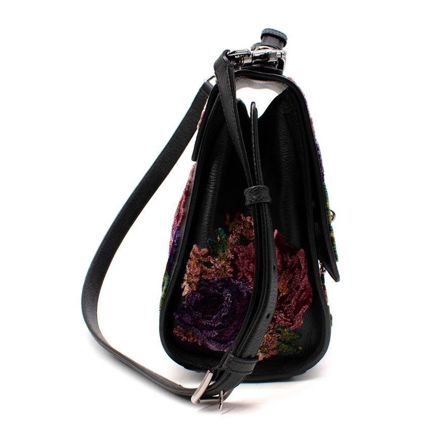 Dolce & Gabbana Monica Floral Velvet Black Leather Bag
 

 - Classic black grained leather top handle Monica bag, updated with a rich, jewel tone floral velvet motif, reminscent of tapestry patterns
 - Black leather top handle, and shoulder strap