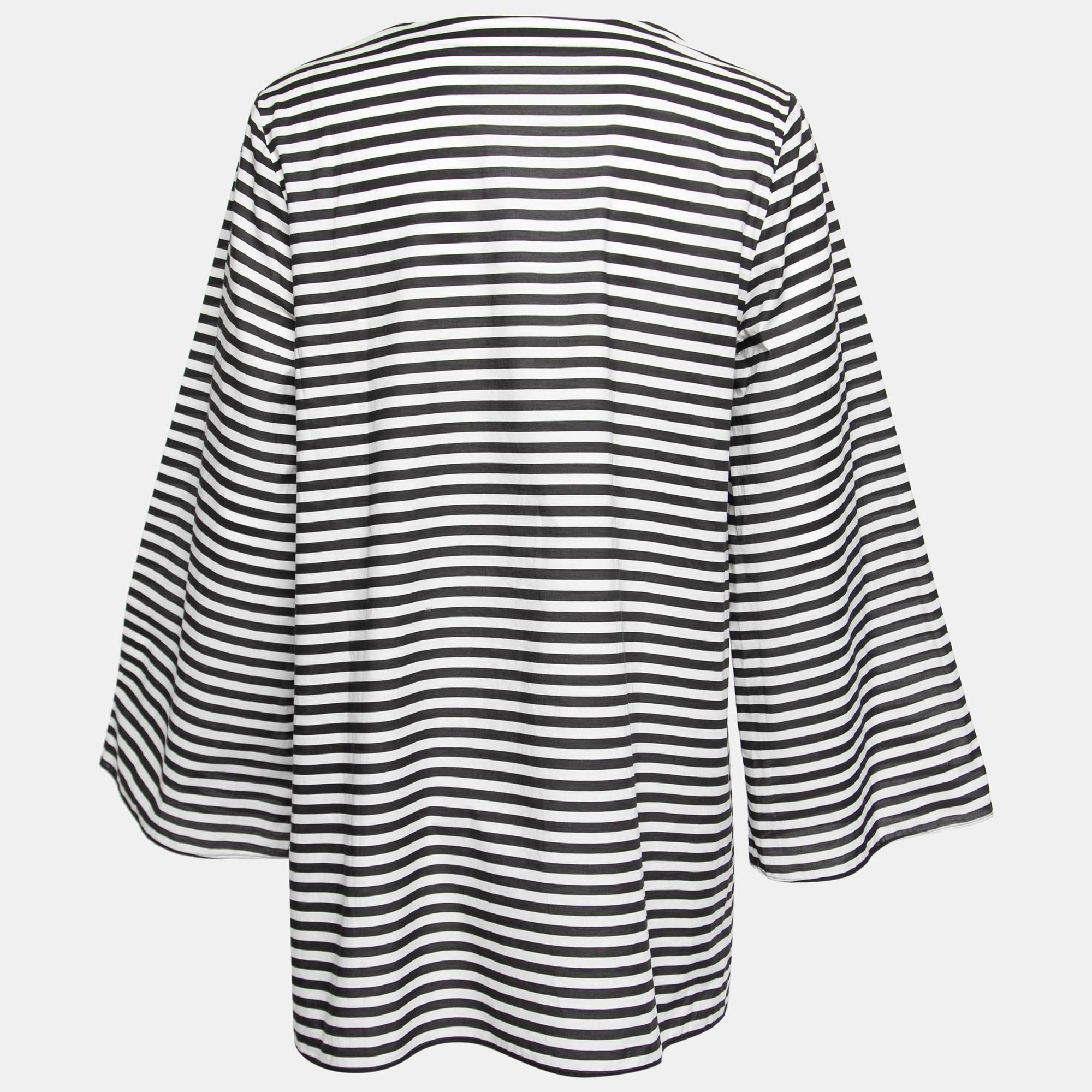 Every beachy vacay calls for statement and comfy pieces like this beach tunic from the House of Dolce & Gabbana. This tunic is made using monochrome striped cotton fabric and features long sleeves and buttoned closures. Don't forget to pack this