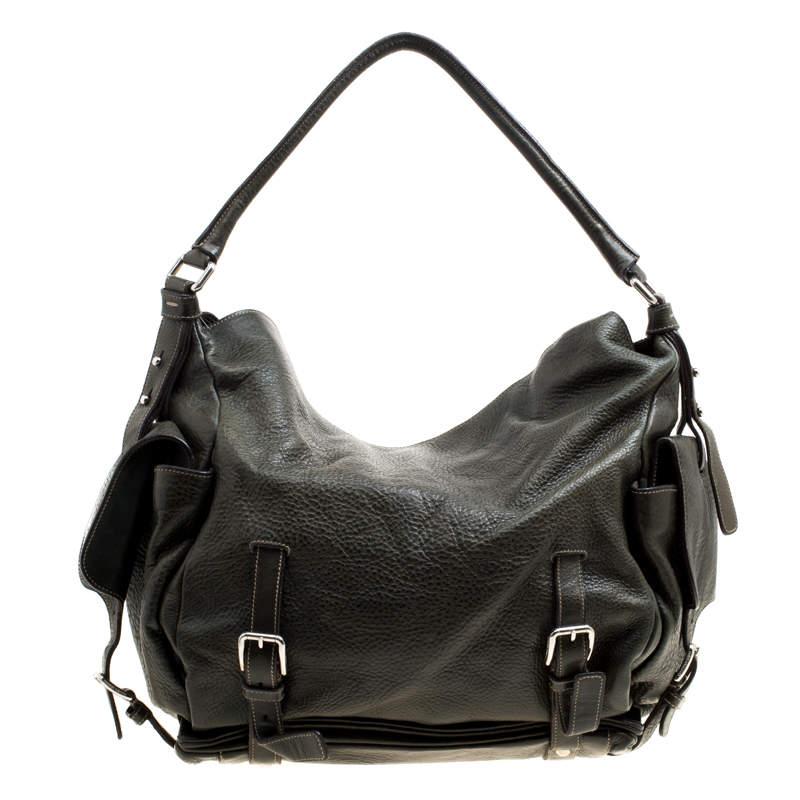 Stylish and handy, Dolce and Gabbana's Miss Forever hobo has been crafted from leather. The mossy green bag features a single top handle, flap pocket on each side and buckle detailing on the exterior. The spacious interior is fabric lined and comes