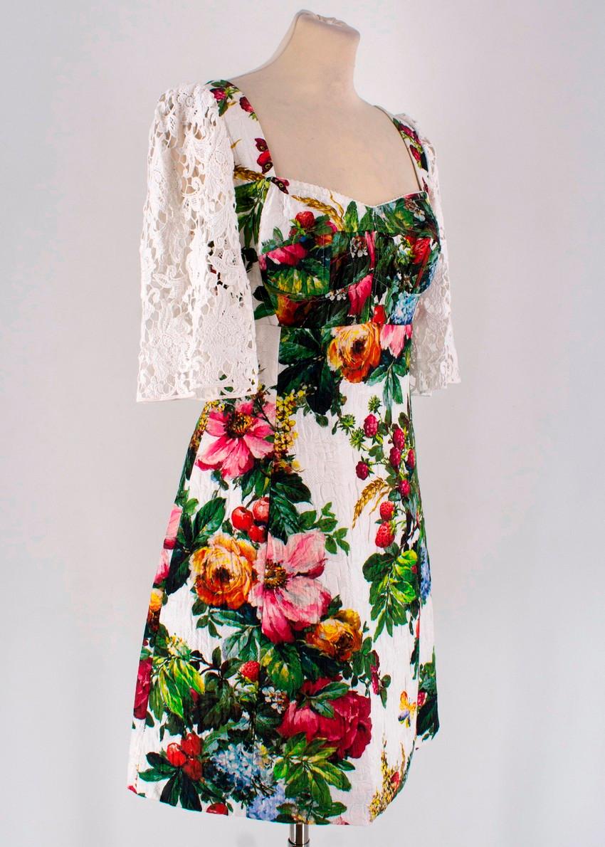 Dolce & Gabbana Multi-Colored Floral Print Dress

-Green/Pink/Blue floral print 
-White lace detail to the sleeve
-Hidden zipper to the back 

Please note, these items are pre-owned and may show signs of being stored even when unworn and unused.