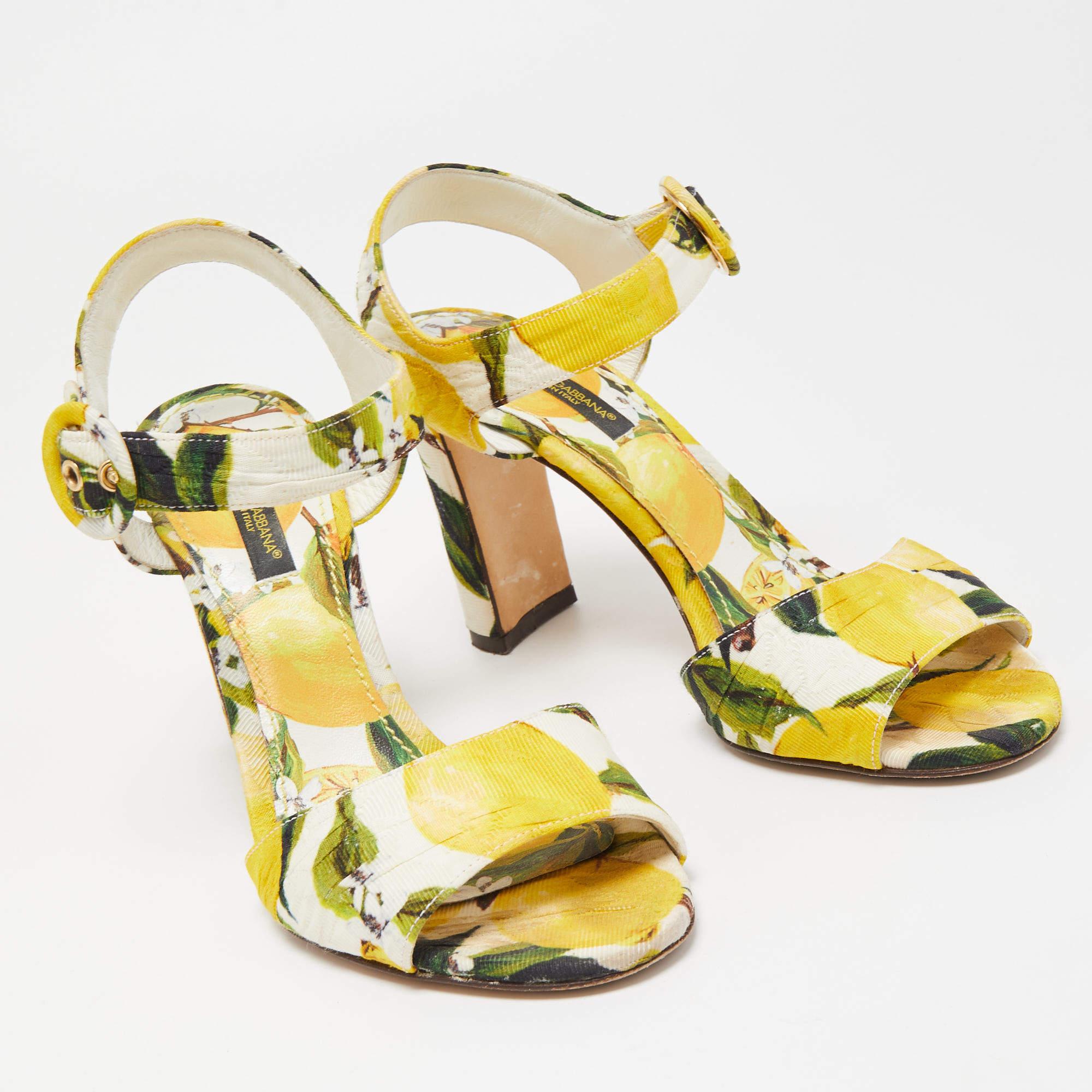 These Dolce & Gabbana sandals are so pretty, they make our hearts flutter with joy! Made in Italy, this pair has a fabric exterior adorned with a vibrant print and ankle straps with a side buckle fastening. The sandals are complete with heels that