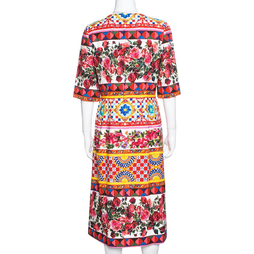 This impressive Dolce & Gabbana midi dress is a go-to option in your wardrobe for every occasion. Choose this multicolor dress that has been crafted from a lovely 'Carretto Roses' printed cotton. It has a lovely silhouette and is secured with a zip