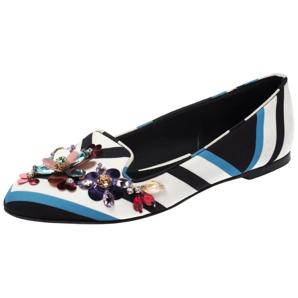 These stylish ballet flats come from Dolce & Gabbana. Crafted from chevron printed fabric, they carry lovely multicolored hues. They are styled with round toes, crystal embellishments on the uppers and gold-tone hardware. They are a great way to