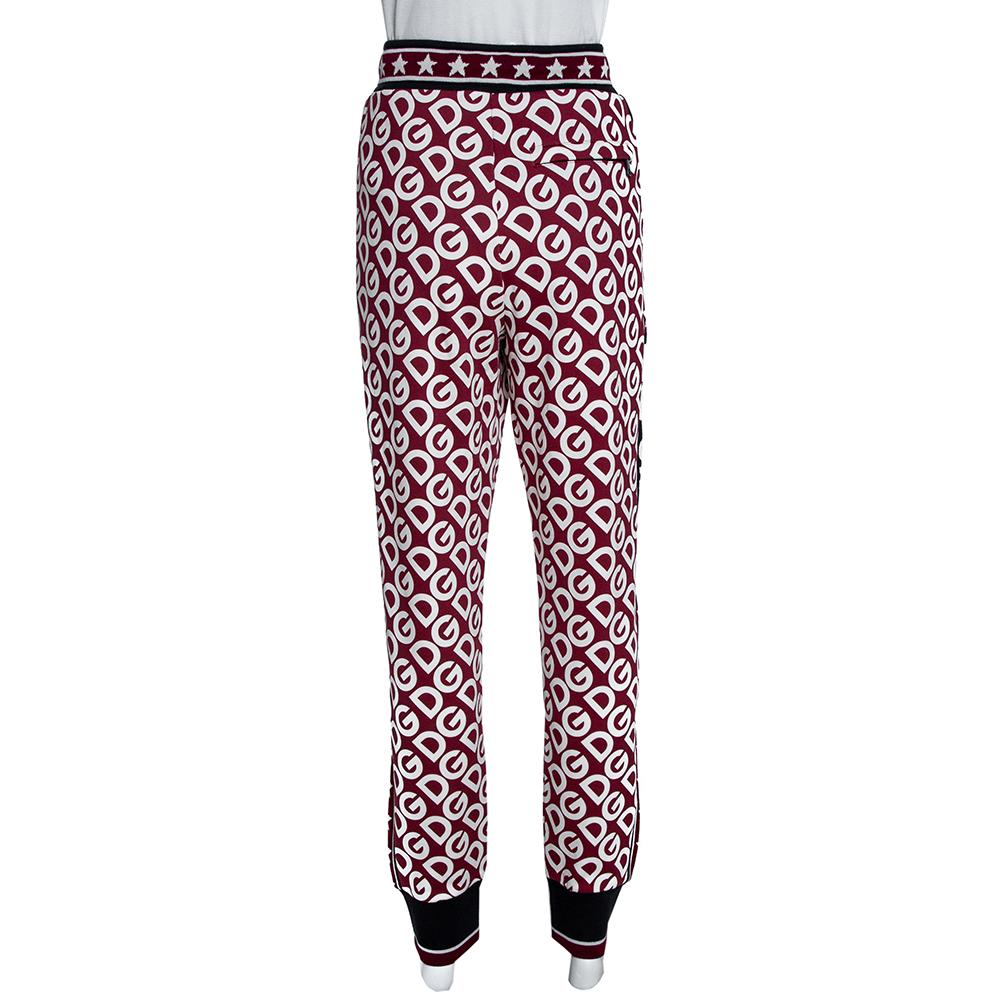 Dolce & Gabbana brings you a trendy spin on sportswear with these stylish track pants. Crafted from cotton jersey, it carries multicolored hues as well as the iconic DG Mania print. Pair with t-shirts and sneakers for a casual look.

