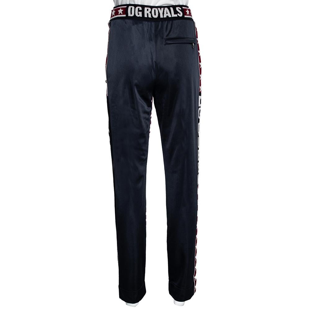 Dolce & Gabbana brings you a trendy spin on sportswear with these stylish track pants. Crafted from durable technical fabric, it carries multicolored hues as well as the iconic DG Mania print. Pair with t-shirts and sneakers for a casual look.

