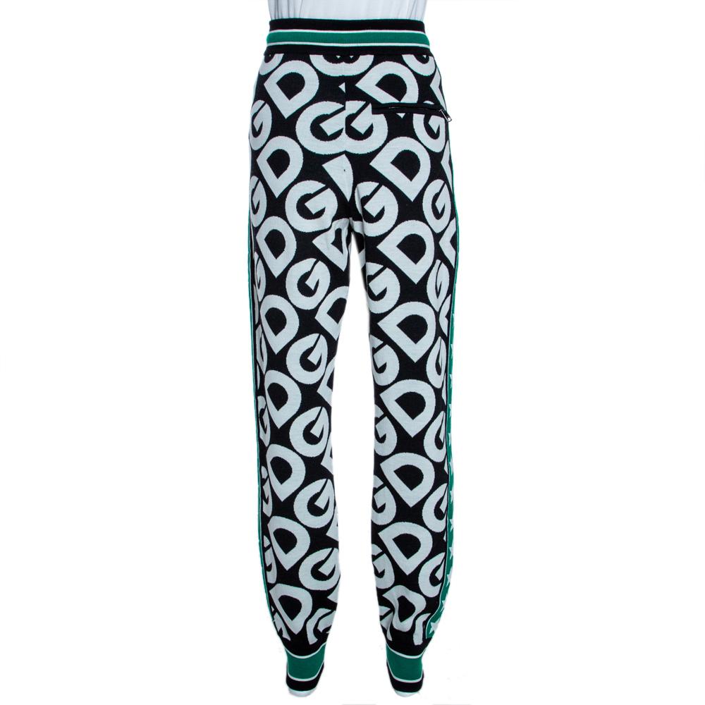 Deck-up for the chilly months with these fabulous track-pants from the iconic house of Dolce & Gabbana. Crafted from pure virgin wool, this luxurious creation carries multicolored hues and the signature DG Mania print throughout. They have a fitted