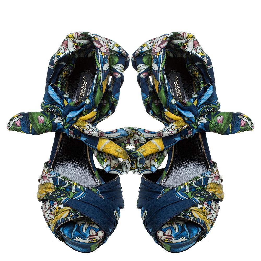 The sight of these sandals from Dolce & Gabbana reminds one of how there are endless ways to design a shoe. The pair has printed fabric-leather straps laid in a crossover style, self-tie ankle fastening, platforms, and 14 cm high heels.

Includes: