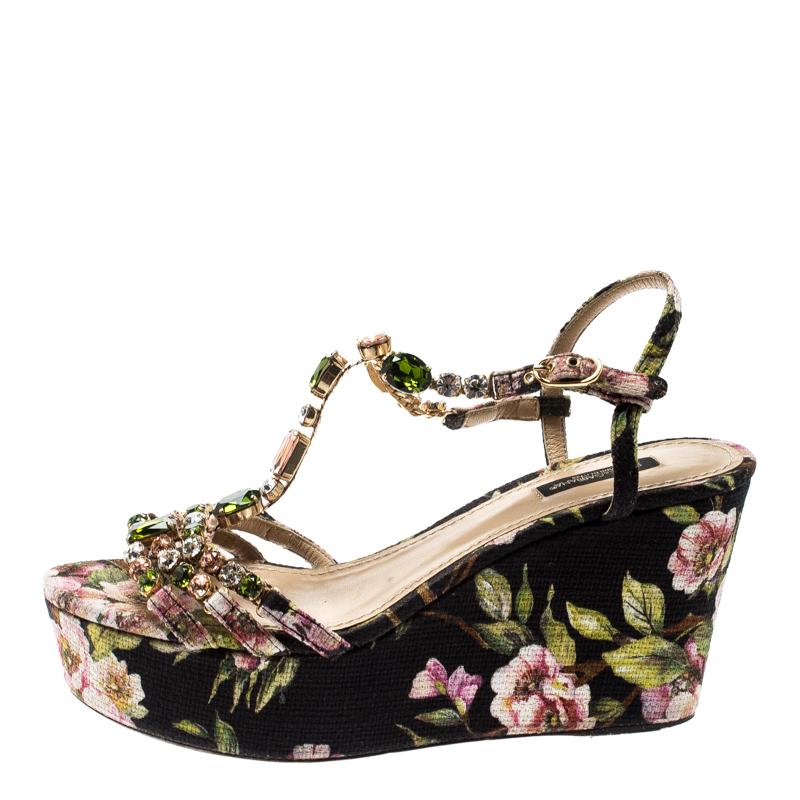 Look stylish always when you wear these beautiful canvas-made sandals. Start exploring your fashion options with this pair that is adorned with floral prints all over and crystal embellishments on the T-strap silhouette. Flaunt your love for trends