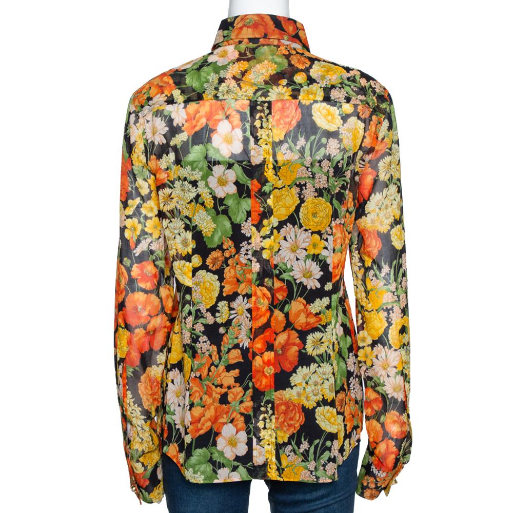 Pretty and stylish, this stunning shirt from the house of Dolce & Gabbana is an absolute must-have. Adorned with colorful florals all over, it comes with long sleeves and button fastenings. Add a touch of feminine charm to your everyday clothing
