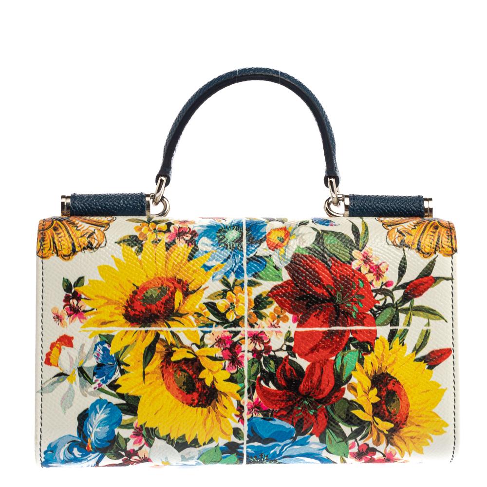 Meticulously crafted from floral-printed leather, this Dolce & Gabbana Sicily Von bag for your smartphone exudes sophistication and signature aesthetics. It has a top handle, shoulder chain and a well-designed interior.

Includes:Authenticity Card,