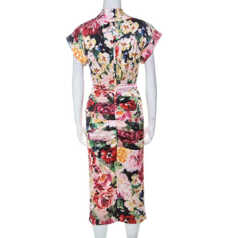 This gorgeous dress from Dolce and Gabbana promises that you'll never go unnoticed whenever you slip into it! The multicoloured creation is made of a silk blend and features a draped design to the front. It flaunts V-neckline and short sleeves.