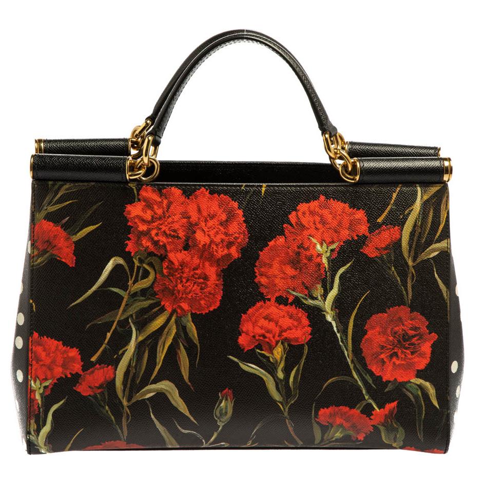 This gorgeous brown Sicily tote bag from Dolce & Gabbana is a handbag coveted by women around the world. It has a well-structured design and opens to a compartment with fabric lining and enough space to fit your essentials. The bag comes with
