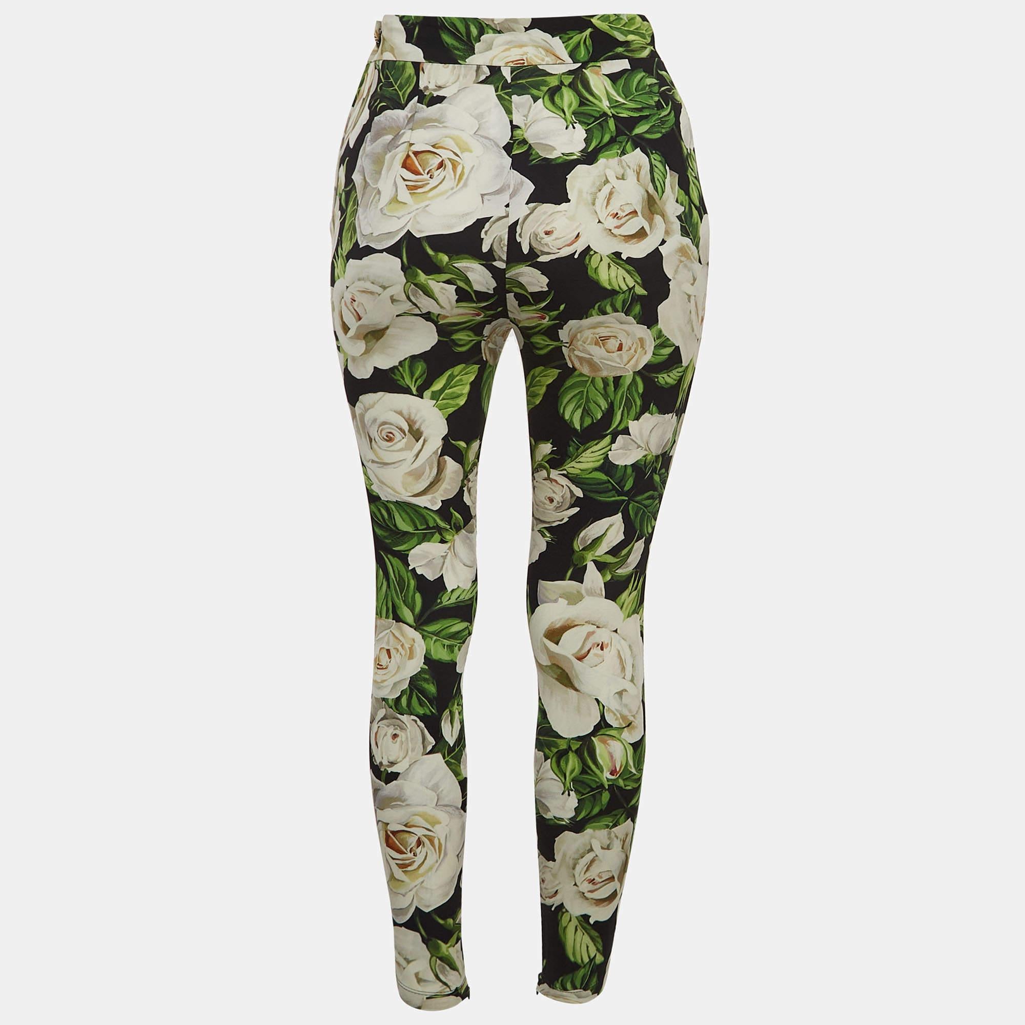 Ultra-modern and cool skin-fitted trousers from Dolce & Gabbana will make you look different from the rest of the crowd. It is crafted from silk, featuring multicolored floral print.

