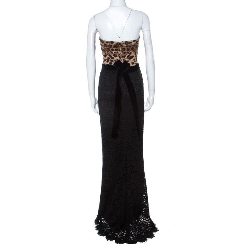 You will love the way you look when you slip this dress on. It is a design from Dolce & Gabbana, wonderfully tailored into a design of sections; a leopard-printed corset followed by a velvet belt and then a gorgeous lace skirt. A choice of bold