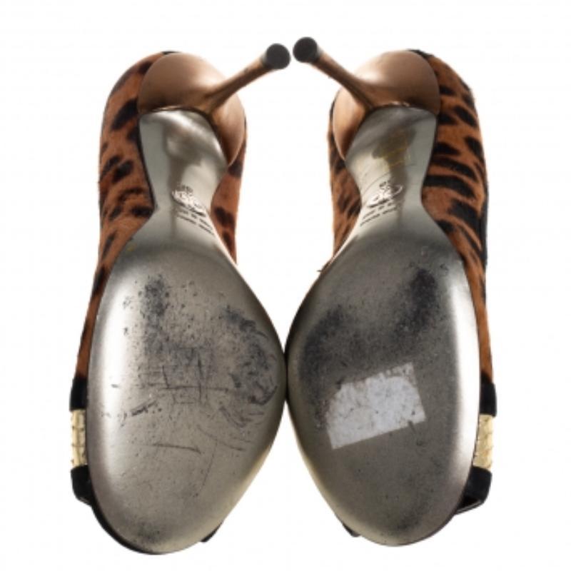 Now here is one pair that truly stands out and deserves all your attention! These multicolor pumps from Dolce & Gabbana have been crafted from pony hair and suede and designed in an open-toe silhouette. They are endowed with comfortable