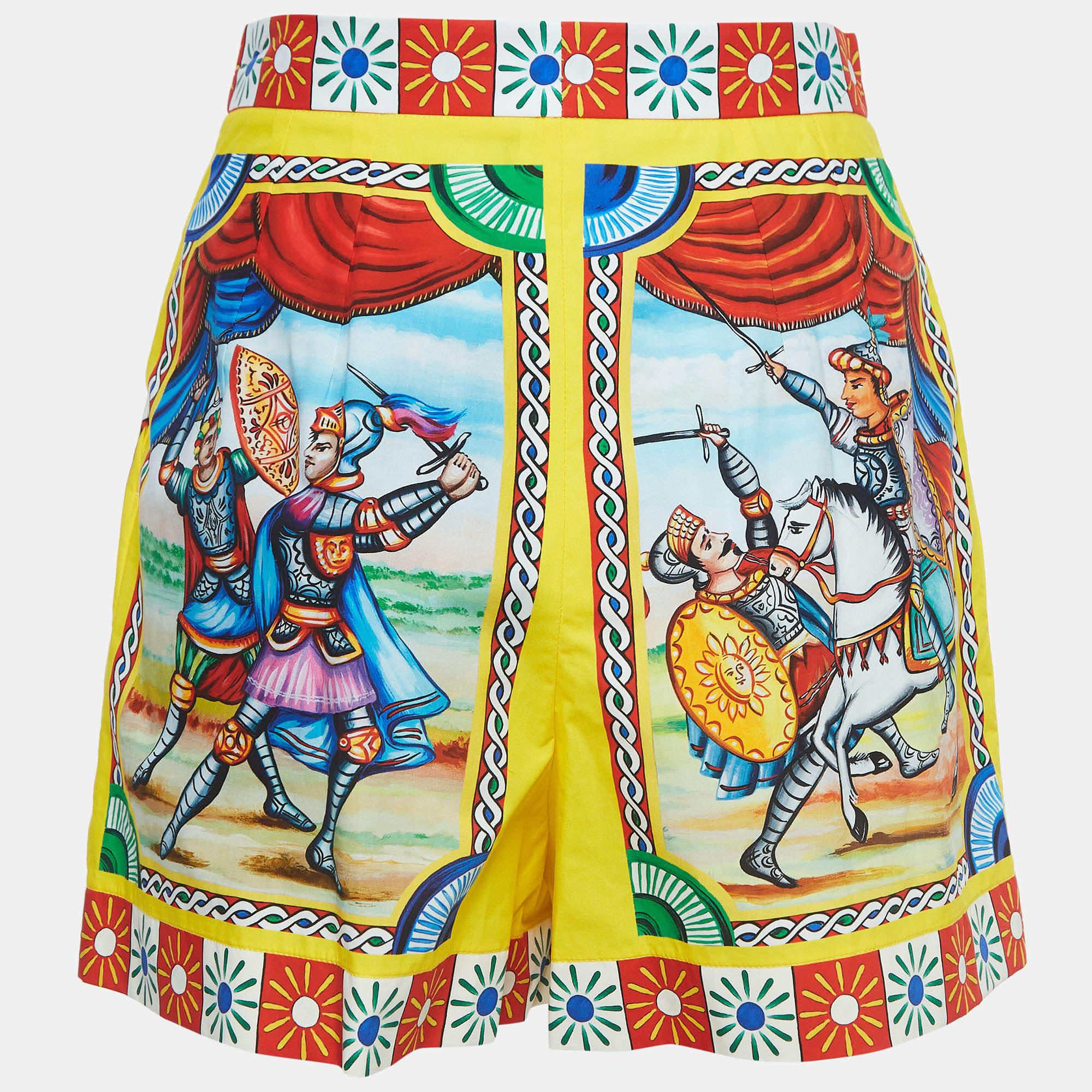 The Dolce & Gabbana shorts are a vibrant embodiment of summer sophistication. Crafted from premium cotton, these shorts boast a striking multicolor print that exudes energy and style. With a flattering high waist design, they offer both comfort and