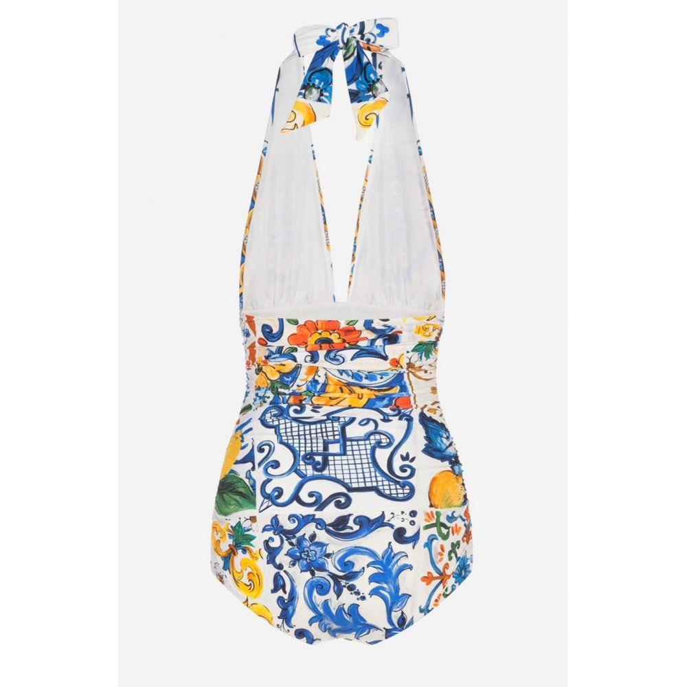 Stunning Dolce & Gabbana one-piece swimsuit which is draped on the sides is made from a precious fabric in the romantic SICILY MAJOLICA print and has an extraordinarily sophisticated look. 
Perfect for both the poolside and as a top for a cocktail