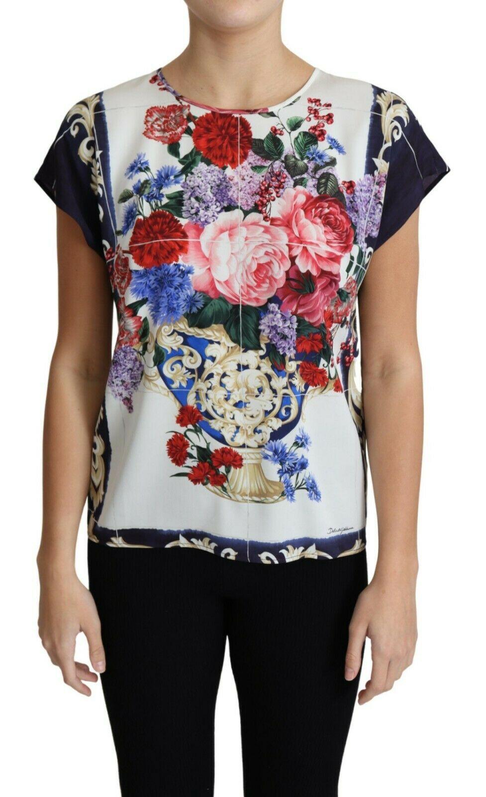 Gorgeous brand new with tags, 100% Authentic Dolce & Gabbana Tops. This delicately crafted piece is cut with cap sleeves and a round neckline with flower vase print emblazoned all over.



Model: Round neck Blouse

Material: 92% Silk 8%
