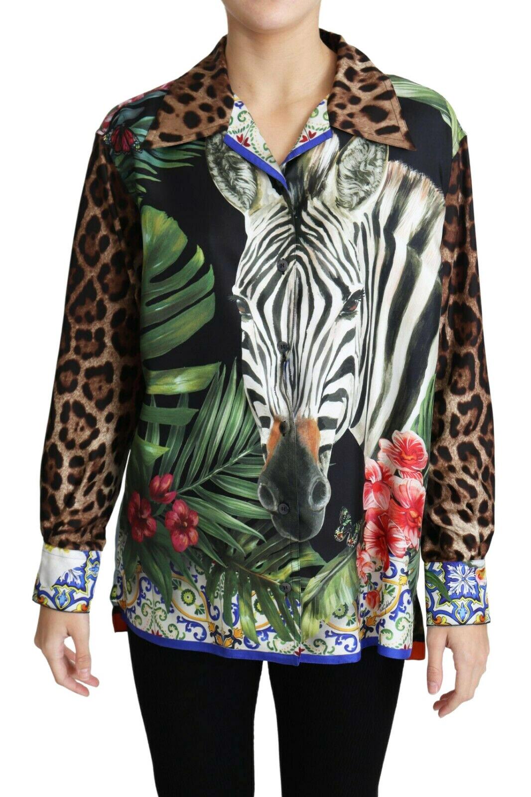 Gorgeous brand new with tags, 100% authentic Dolce & Gabbana oversized silk twill shirt-blouse, enriched with a mix of tropical and wild animal prints. 

Hawaiian collar, button front, straight hem with small side slits.


Style: Collared Oversized