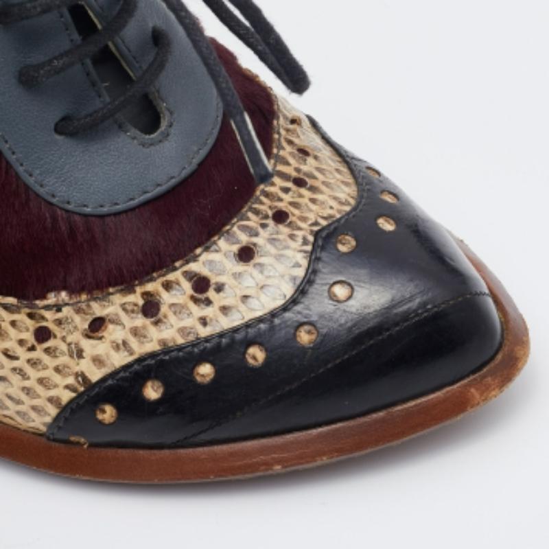 Donna Dolce & Gabbana, stivali in pelle di serpente e pelle di vitello con lacci, misura 38,5 in vendita