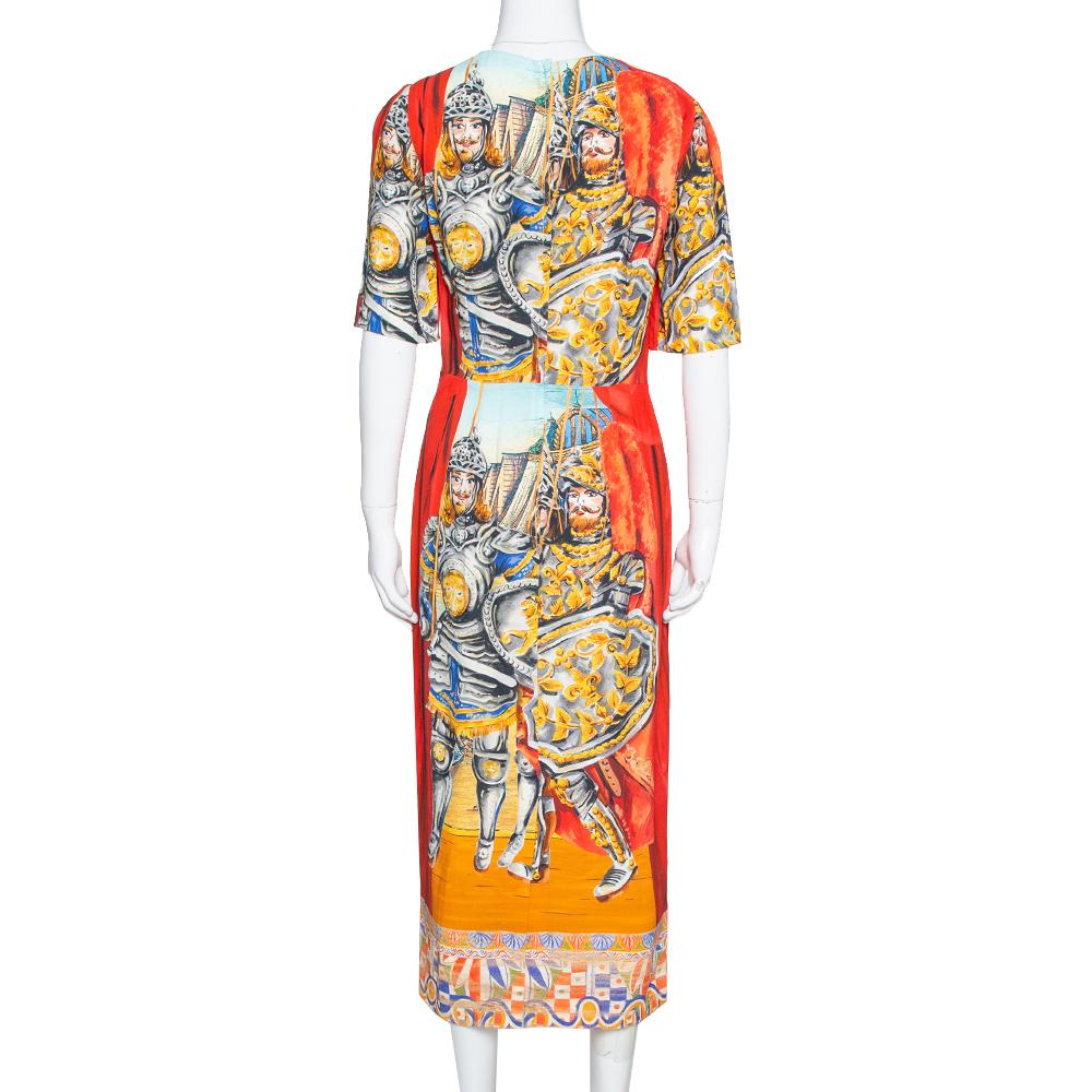 This lovely sheath dress comes from the iconic house of Dolce & Gabbana. The brand's penchant for stunning and vibrant prints is reflected in the creation. It is crafted from crepe and comes in lovely multicolored hues and carries a soldier print