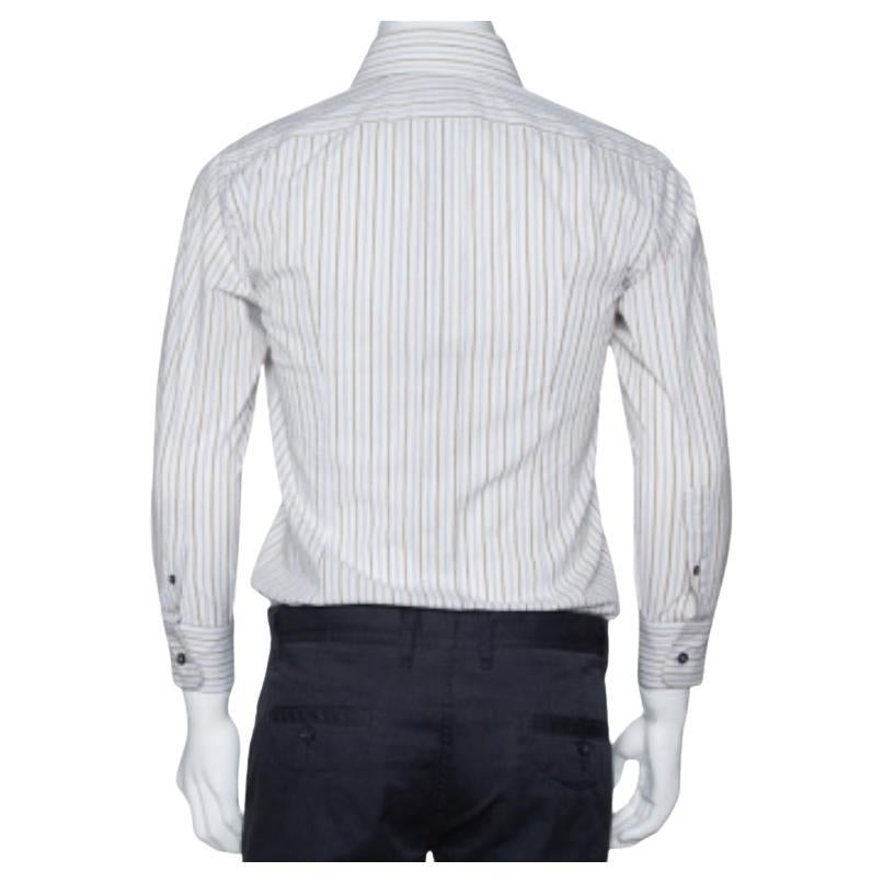 Perfect office wear, this shirt by Dolce & Gabbana is a power statement. It has been crafted from cotton. It comes in multicolored shades and carries a striped exterior. It has long sleeves, button front, a simple collar, and is tailored to offer a
