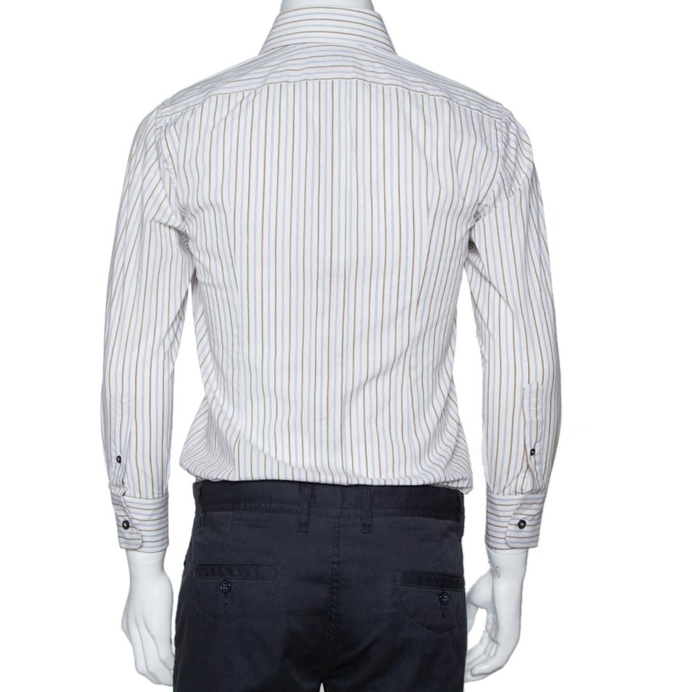 Perfect office wear, this shirt by Dolce & Gabbana is a power statement. It has been crafted from cotton. It comes in multicolored shades and carries a striped exterior. It has long sleeves, button front, a simple collar, and is tailored to offer a