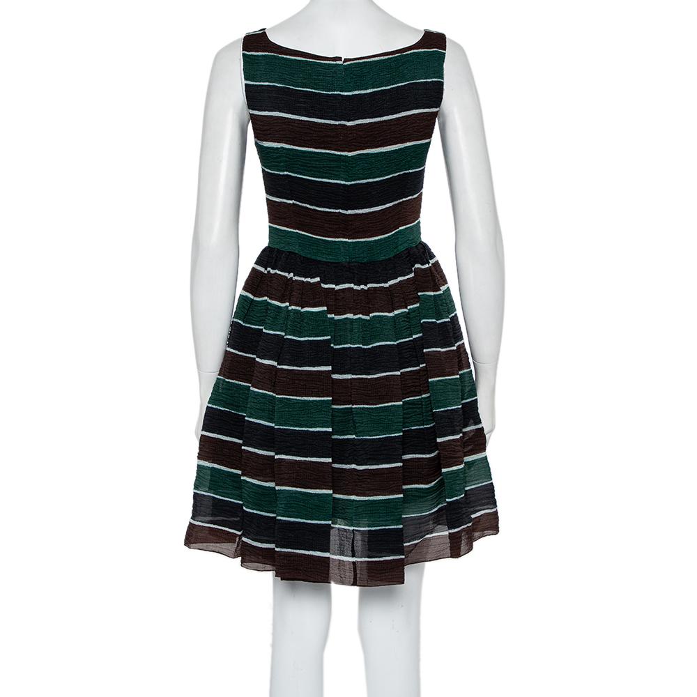 Dolce & Gabbana has a chic and free-flowing spirit that is translated effortlessly in this mini dress. Made from textured silk, the creation is adorned with stripes, a fitted bodice, a flared skirt with pleated details.

