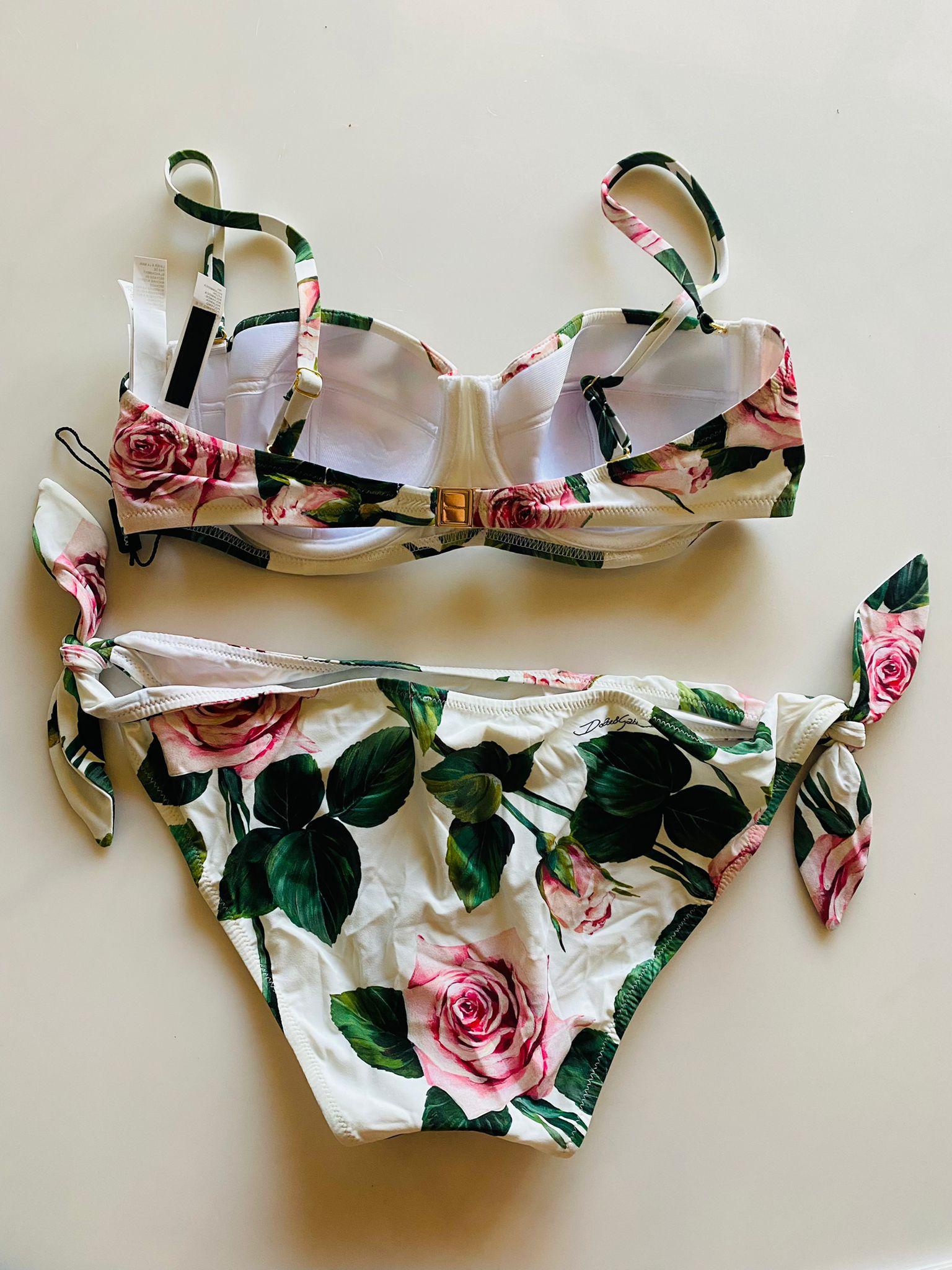 Dolce & Gabbana timeless balconette bikini top and bottoms set in fine fabric comes in TROPICAL ROSE print and is perfect for enhancing every woman’s femininity:
-	Bra with padded cups and wiring
-	Adjustable bows on the sides
-	Rear branded