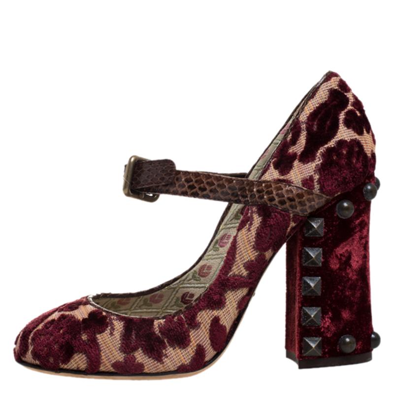 Take your style to another level with this pair of Mary Jane pumps from Dolce & Gabbana. Crafted in Italy from quality velvet & canvas, they feature round toes and Mary Jane straps with buckle closures. They are accented with floral motifs and 10.5