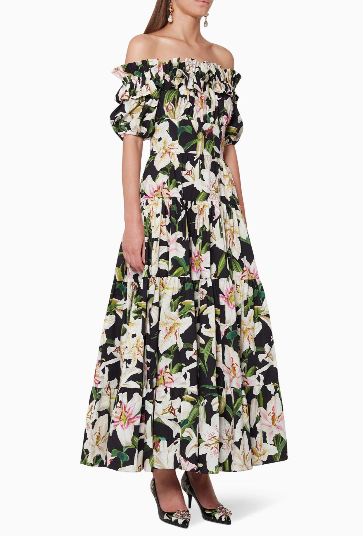 Gorgeous brand new with tags, 100% Authentic Dolce & Gabbana long cotton poplin dress with floral print features a straight neckline with ruches and elastic, short elasticated sleeves, partially lined, rear zipper and hook-and-eye fastening.

Model: