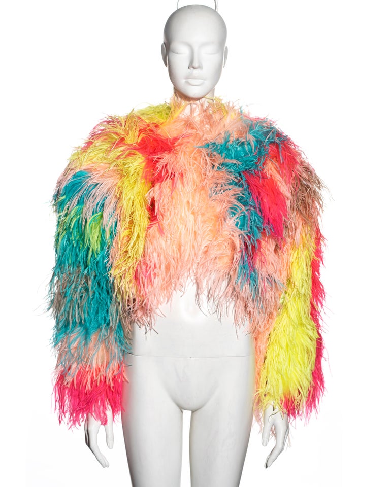 ▪ Dolce & Gabbana multicoloured ostrich-feather embellished bolero jacket
▪ Ostrich feathers dyed in pink, green, yellow, brown, blue, green and peach 
▪ Horizontal stripe pattern
▪ Round neck
▪ Front hook and eye fastening
▪ Silk lining 
▪ IT 42 -