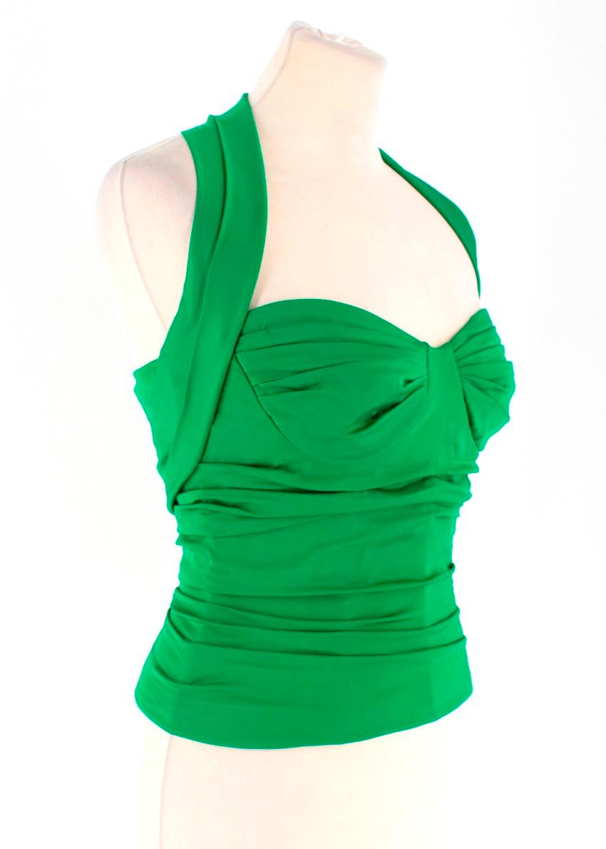 Dolce & Gabbana Green Corset Silk Top

-Green ruched fabric
-Halter neckline 
-Two snap buttons to the halter accent 
-Hidden zipper to the back

Please note, these items are pre-owned and may show signs of being stored even when unworn and unused.