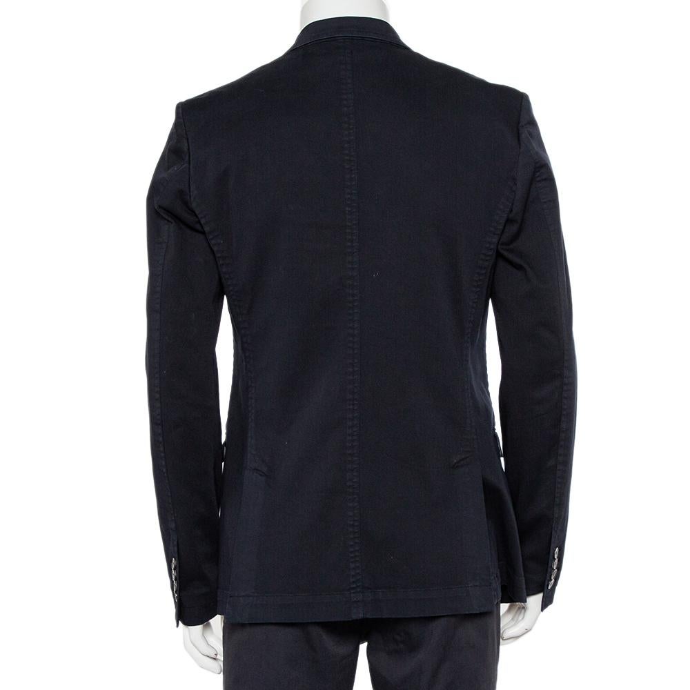 Put together a refined look with this Dolce & Gabbana blazer as the last addition to your outfit of the day. Created using denim, the navy blue blazer for men has a double-breasted front, comfortable lining, and a great fit.

