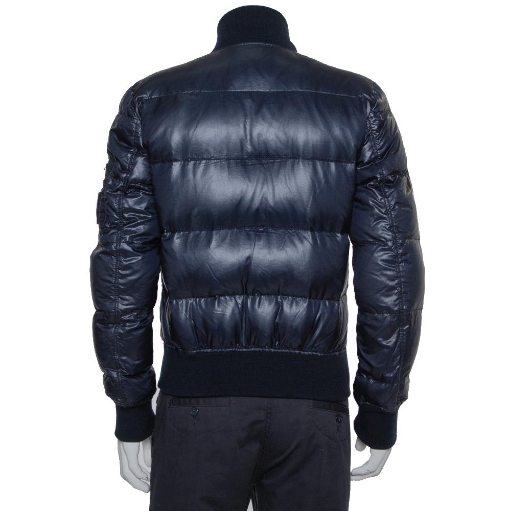 Stay warm in this ultra-stylish puffer jacket by Dolce & Gabbana. Designed in a fashionable silhouette, the blue quilted jacket, tailored from quality materials, will look great with your winter separates. It features a full front zip fastening,