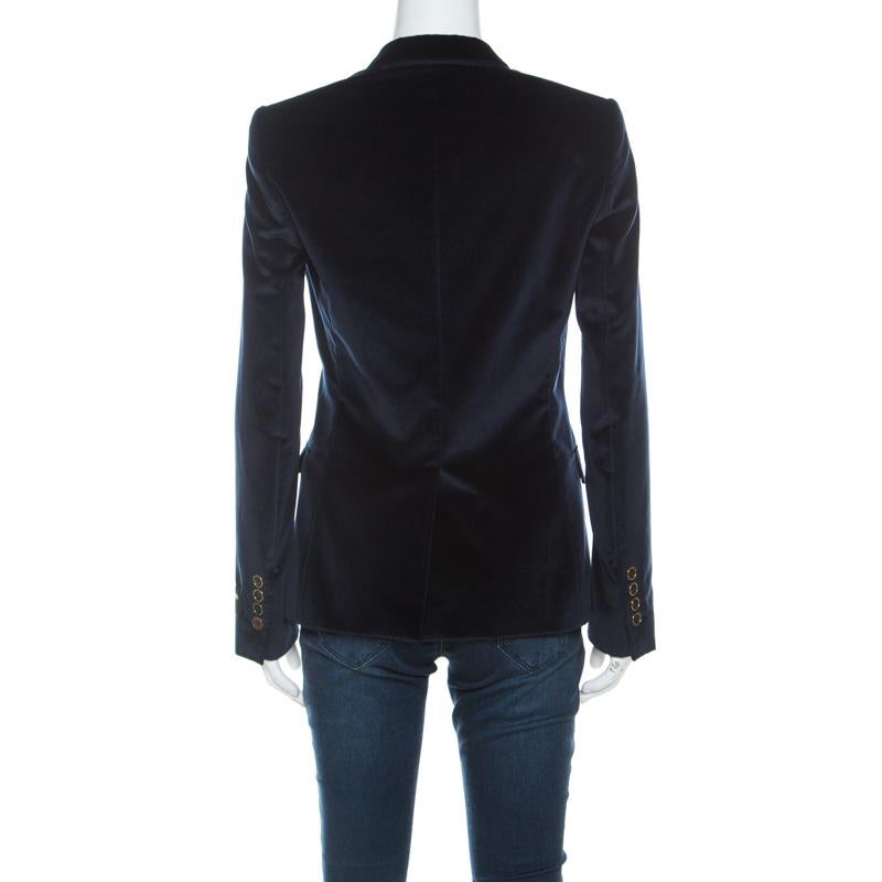 Gorgeous and comfortable, this blazer from Dolce & Gabbana will make others nod in admiration. The fabulous navy blue blazer is tailored from velvet, and it features front buttons, notched lapels and pockets.

