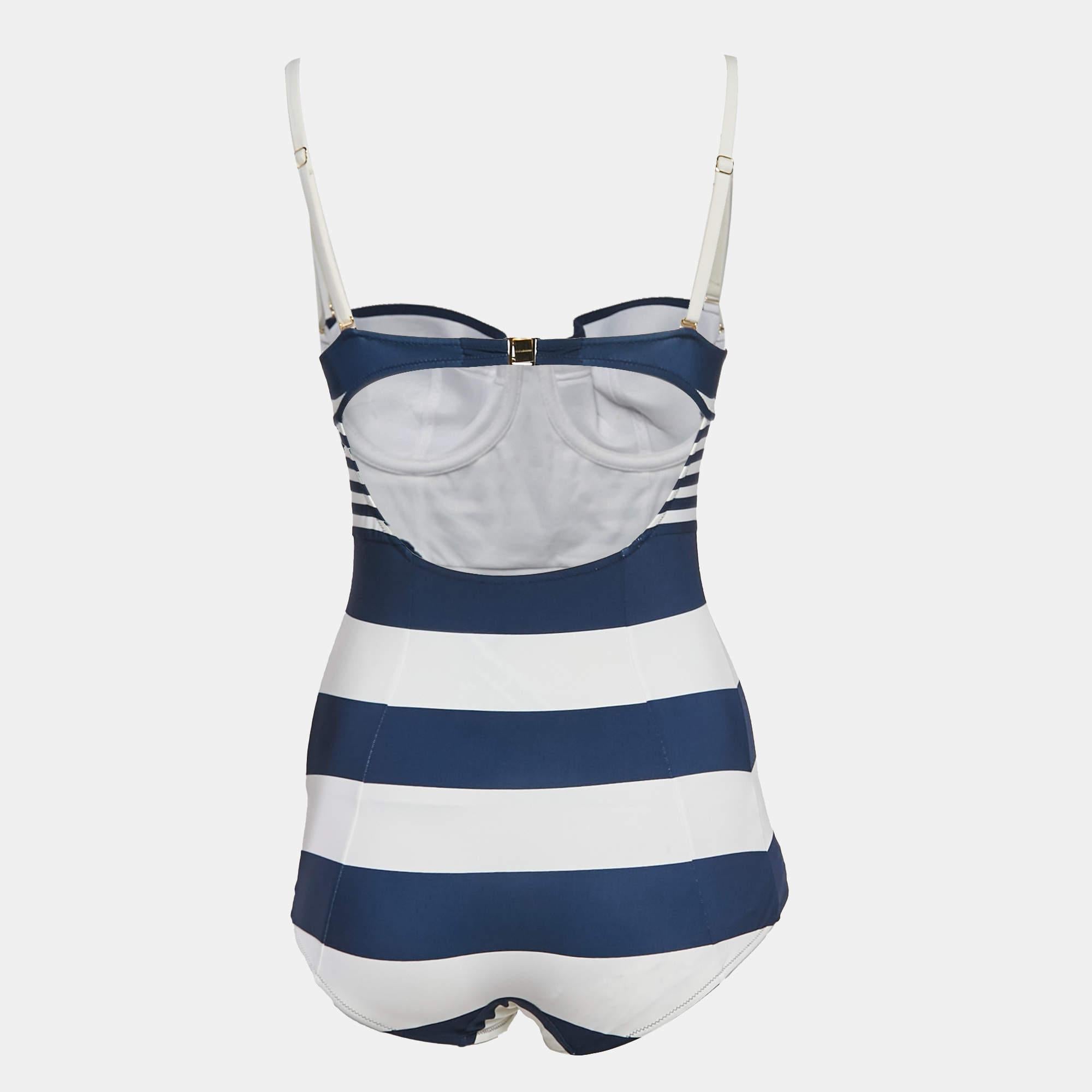 The Dolce and Gabbana navy blue and white striped jersey swimsuit offers a chic  nautical inspired look. Made from a soft  stretchy fabric  it provides a comfortable fit while flattering the figure with its sleek silhouette. Featuring a classic