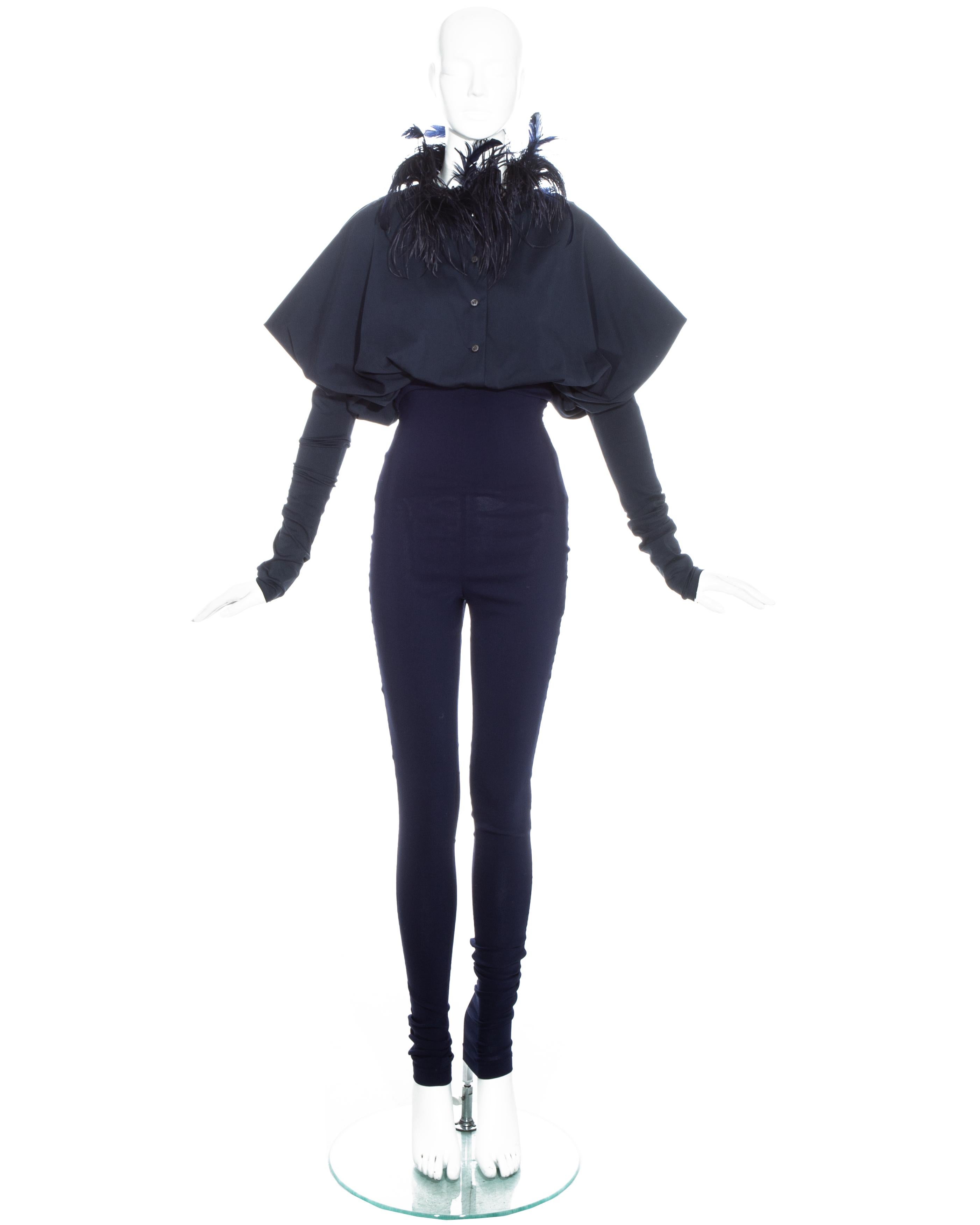 Dolce & Gabbana navy cotton spandex pant suit comprising: wide cut button up blouse with fitted sleeves and feathered collar, and fitted high waisted pants. 

Fall-Winter 1990