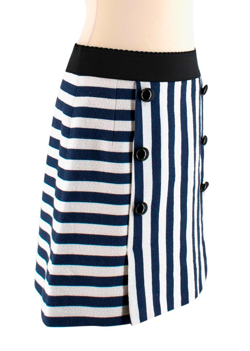 Dolce & Gabbana Navy, White stripe skirt 

-Elastic band waist 
-Front flap
-Black bottoms along front 
-Elastic waist, back zipper 

Material 
-99% Cotton 
-1% Elastane 
-96% Silk Lining 
-4% Elastane 

-Dry clean only 

Made in Italy

Please note,