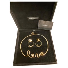 Dolce
Gabbana Necklace and Earring Matching "Love" Set with Box Dolce
Gabbana Necklace and Earring Matching "Love" Set with Box