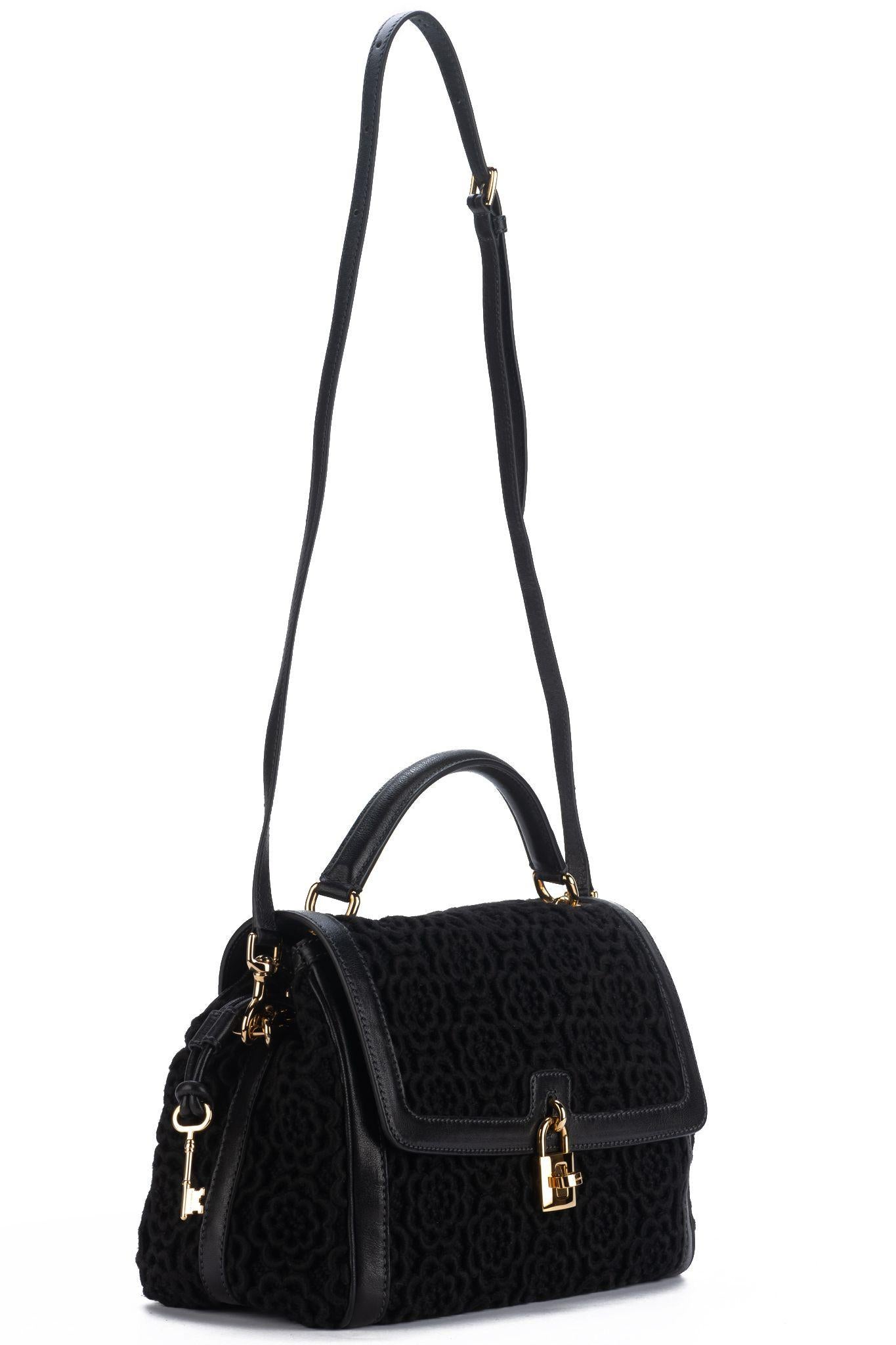 Dolce e Gabbana new with tag black macrame bag with handle and detachable strap. Handle drop 5.5”, shoulder drop 22”. Comes with tag, ID card, booklet and original dust cover.

