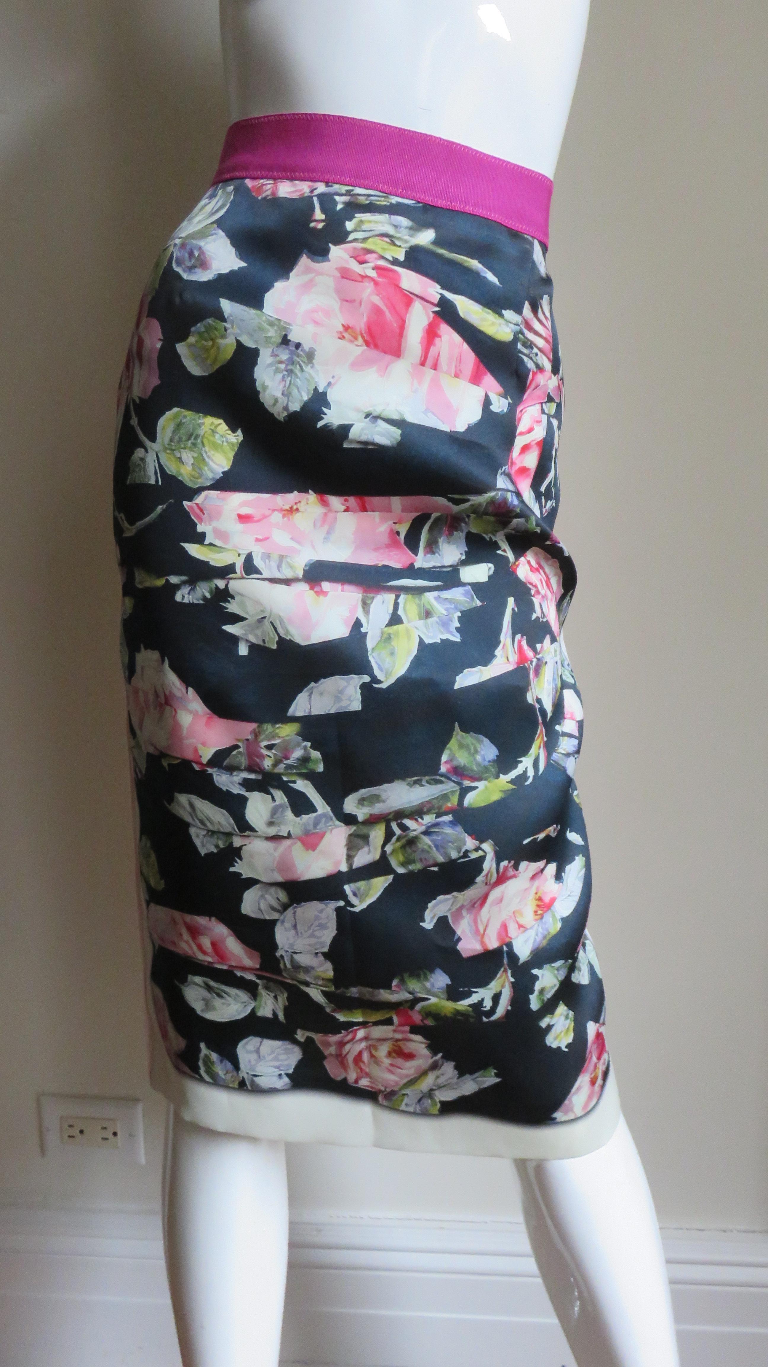 A fabulous silk skirt from Dolce and Gabbana in black, white and shades of pink. It is pencil style with a 2