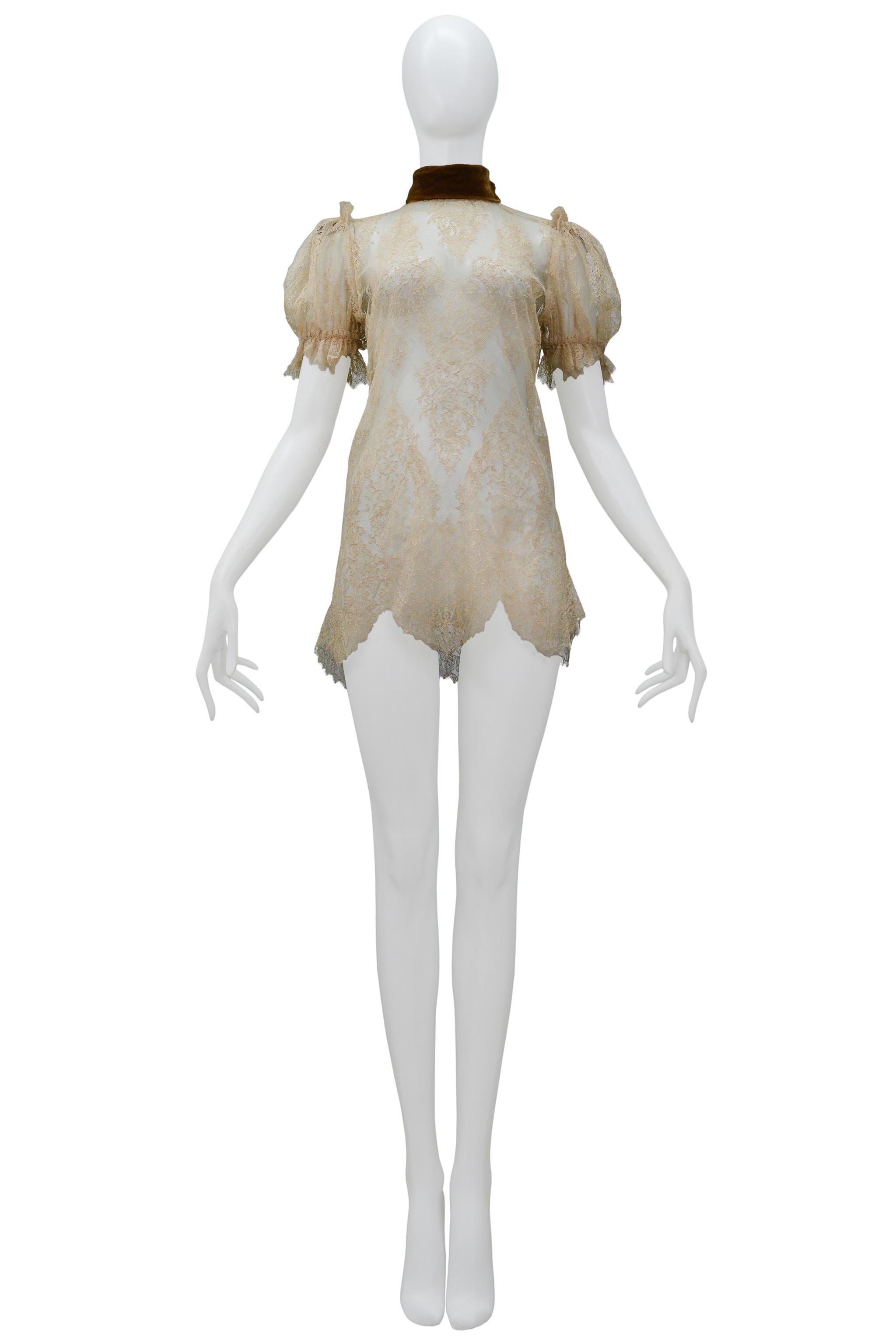 Resurrection Vintage is excited to offer a vintage Dolce & Gabbana off-white lace mini dress featuring puff short sleeves, a brown copper-colored collar, and a zipper at the back.

Dolce & Gabbana
Lace
38
Circa 2001
Made in Italy
Excellent Vintage