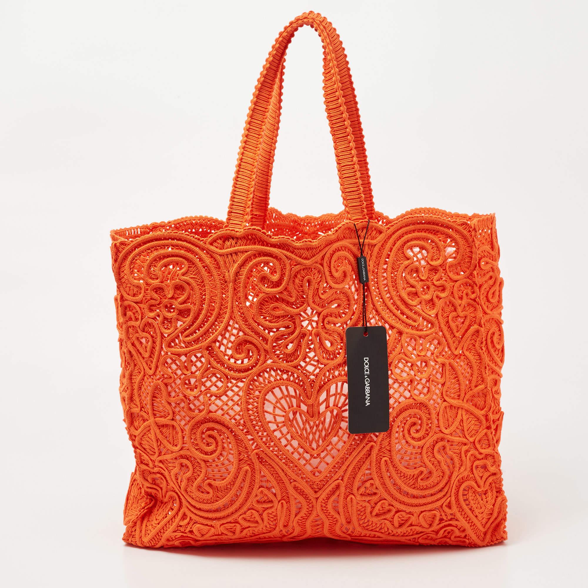 This Dolce & Gabbana crochet Beatrice tote will make a fine pick for when you're heading to a lunch date or curating a vacation edit. We like the vibrant color, simple details, and its high-quality finish.

Includes: Original Dustbag, Tag

