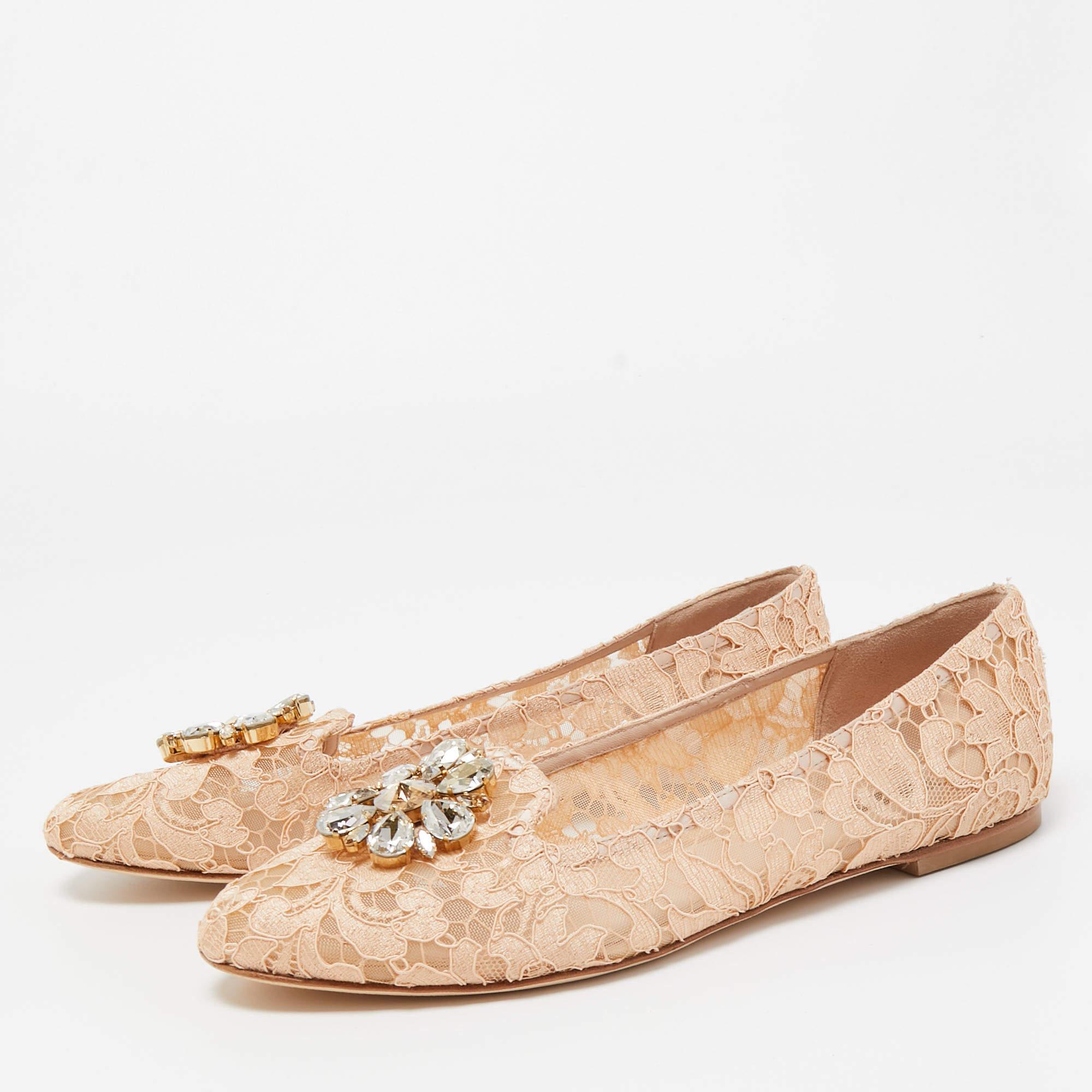Made from lace, these Dolce & Gabbana flats are the ultimate glamor pair. Their exterior comes with Bellucci crystal embellishments on their pointed toes. The interiors are leather lined.

